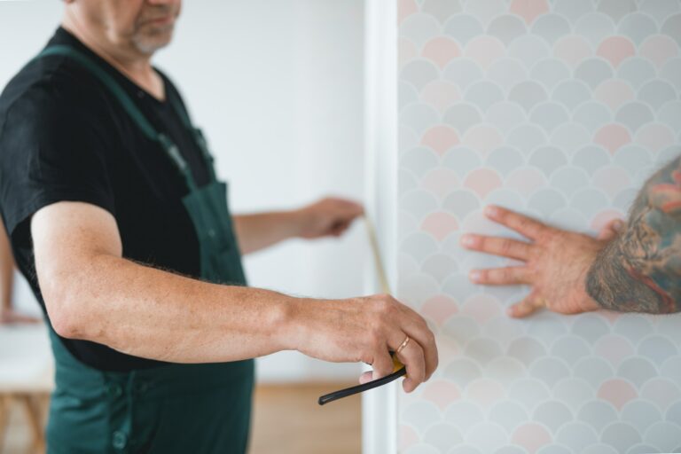 Professional repair team measures the wall before renovation of the living room